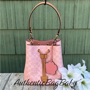 Coach Rowan Bucket Bag In Signature Canvas With Charm Powder Pink Purse